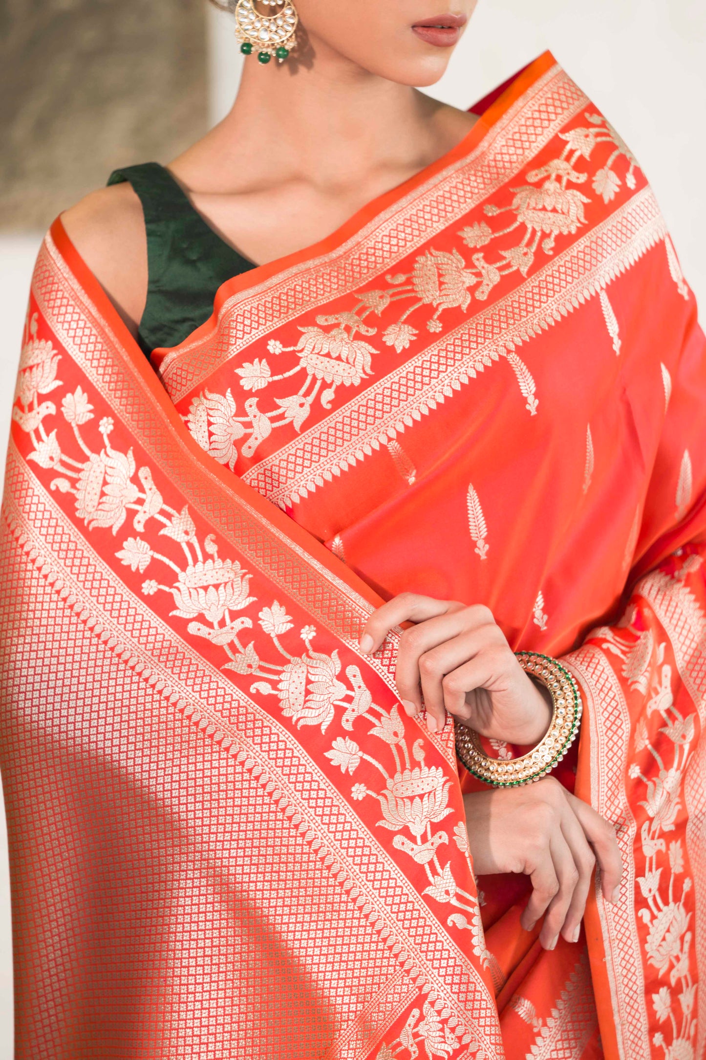 Orange Mashru Silk Saree woven in Leaf inspired butis across body paired with Floral bel border