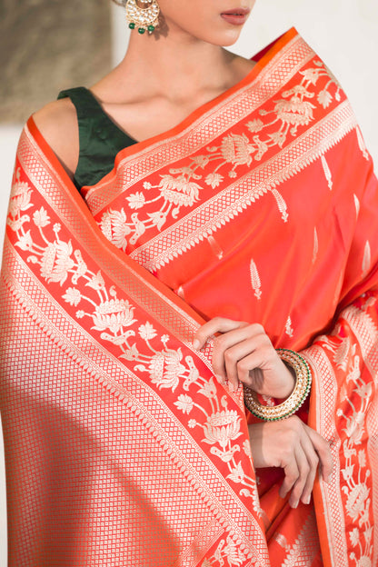 Orange Mashru Silk Saree woven in Leaf inspired butis across body paired with Floral bel border