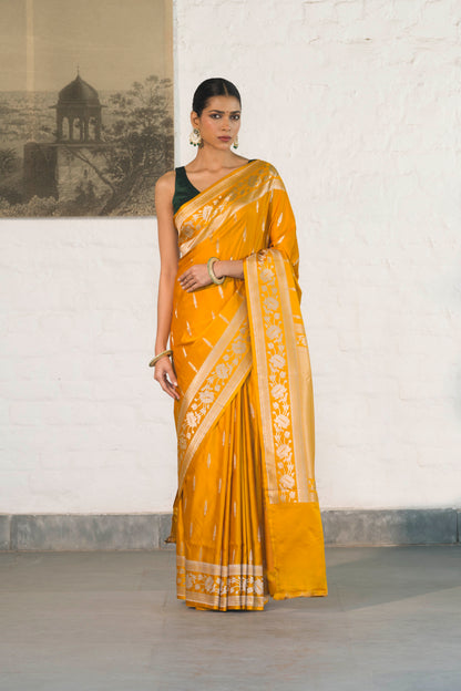 Yellow Mashru Silk Saree woven in Leaf inspired butis across body paired with Floral bel border